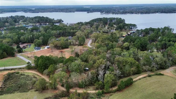 an aerial view of mountain with lake view