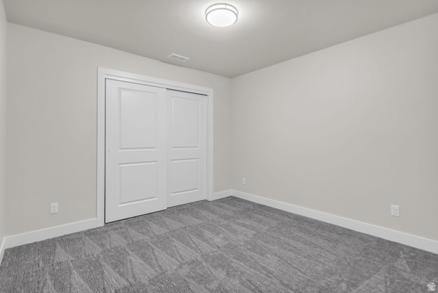 578 West 7th Midvale, UT 84047 - Photo 17 of 35 Unfurnished bedroom featuring a closet and carpet flooring