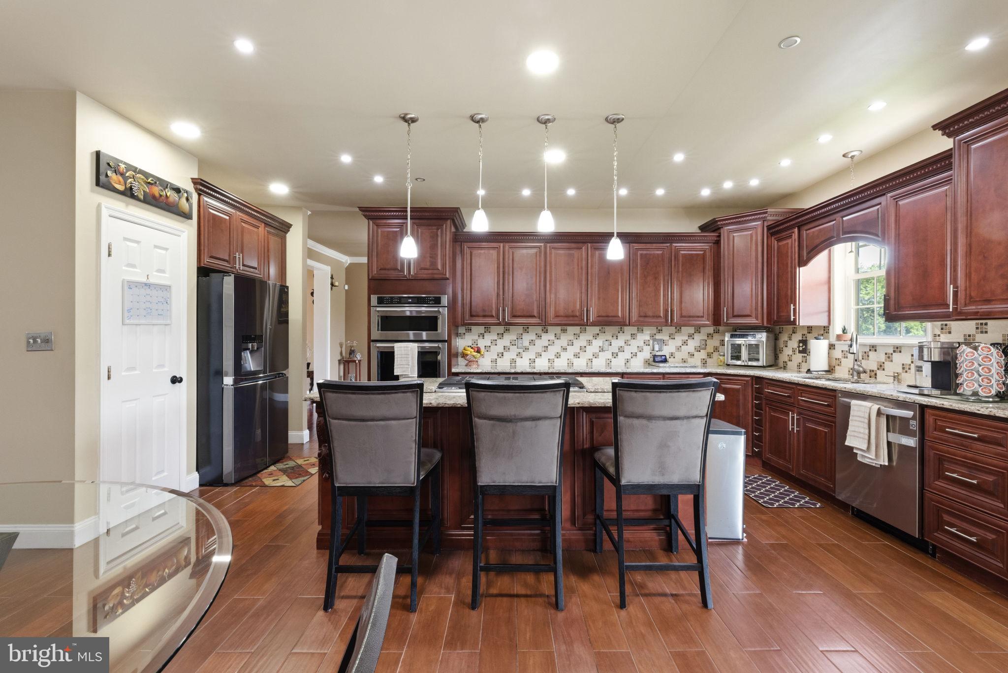 17 Paddock Road Marlton, NJ 08053 - Photo 14 of 54 Elegant kitchen with rich wood tones.