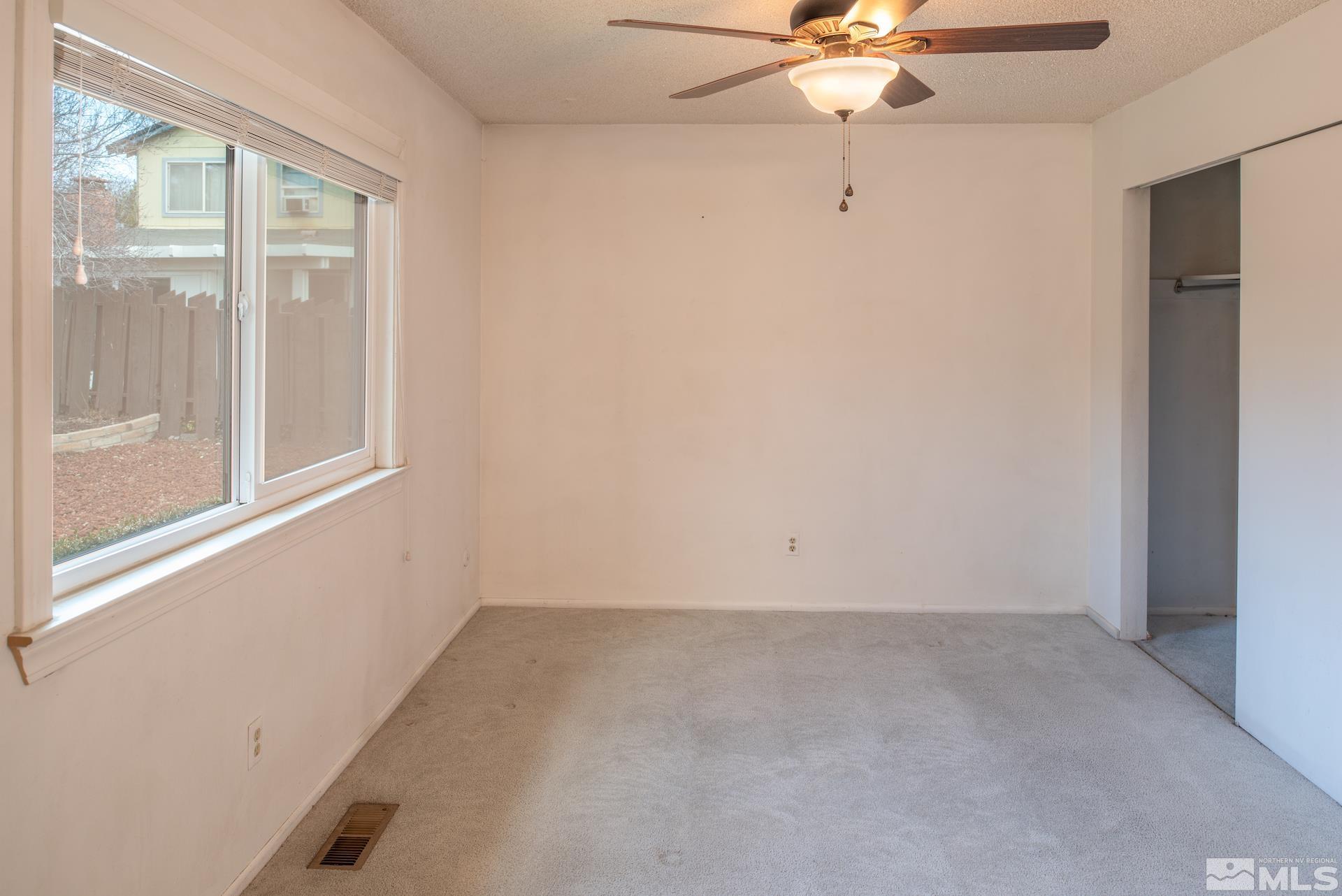 2055 Prince Way Reno, NV 89503 - Photo 16 of 35 an empty room with a window and a fan