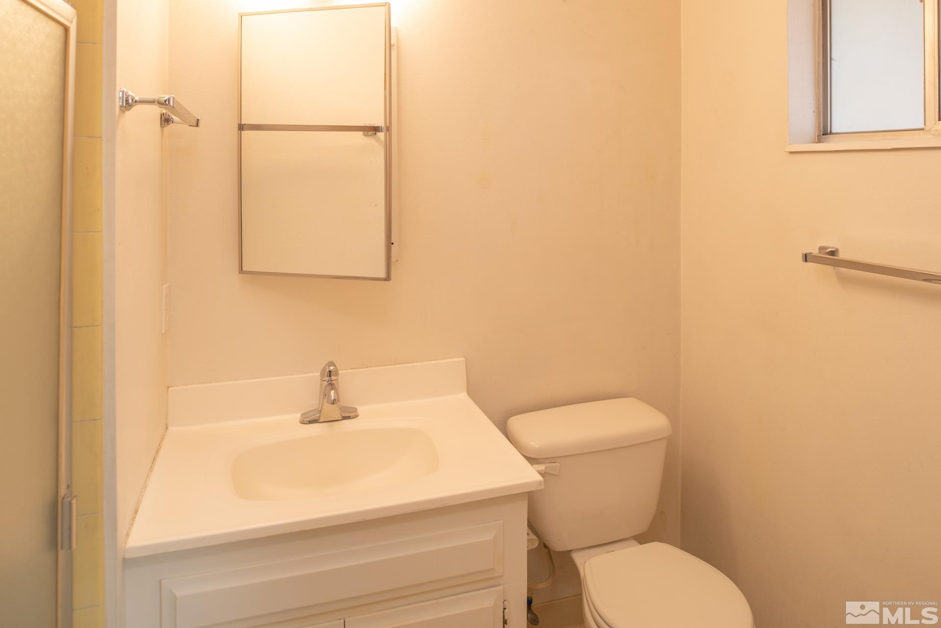 2055 Prince Way Reno, NV 89503 - Photo 17 of 35 a white toilet sitting next to a bathroom sink
