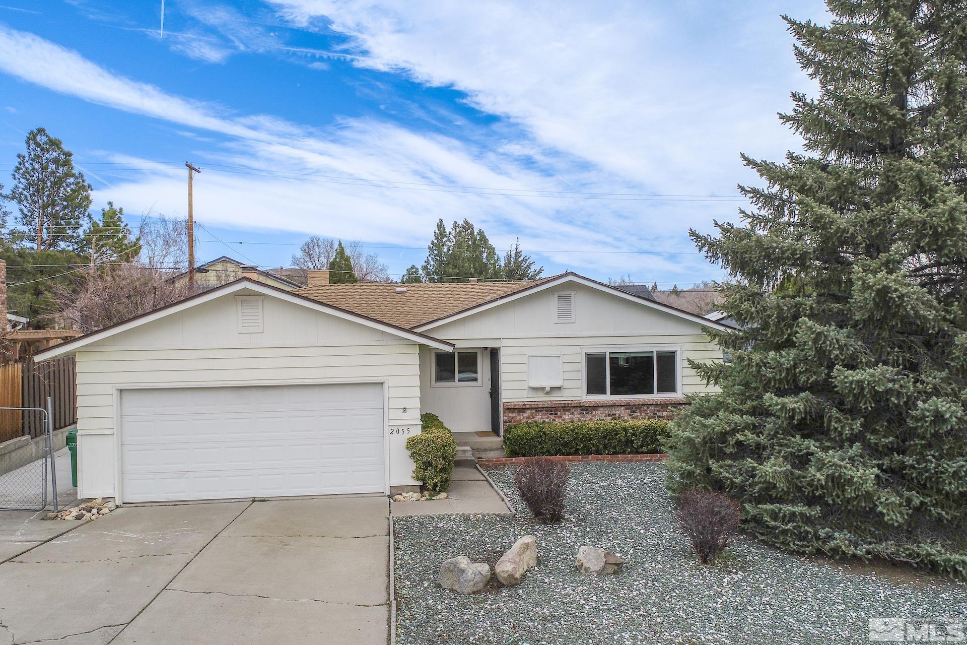 2055 Prince Way Reno, NV 89503 - Photo 33 of 35 a front view of a house with a yard and garage