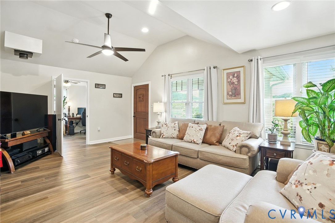 1946 Walmsley Road Callao, VA 22435 - Photo 6 of 49 a living room with furniture flat screen tv and a large window