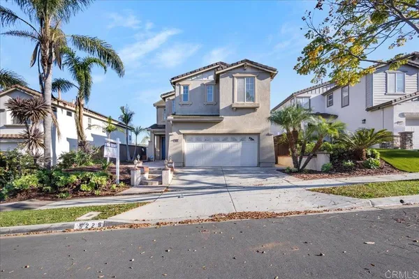 a view of a house with a street