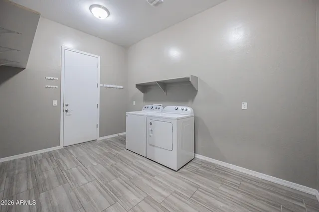 a utility room with washer and dryer