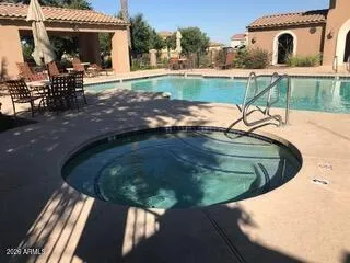 a view of a swimming pool with a patio