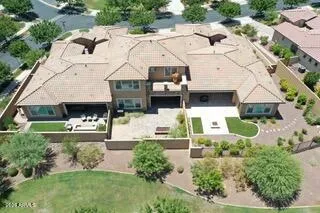 an aerial view of residential houses with outdoor space and street view