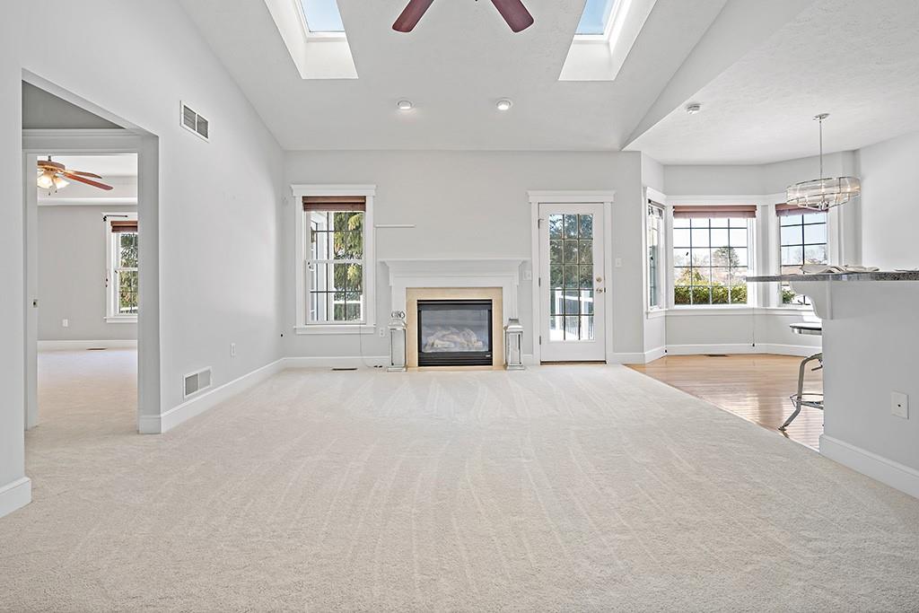 267 Berkeley Way Monroeville, PA 15146 - Photo 5 of 25 a view of an empty room with a fireplace and a window