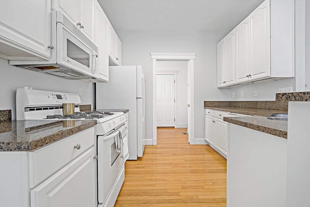 267 Berkeley Way Monroeville, PA 15146 - Photo 10 of 25 a kitchen with granite countertop white cabinets and white appliances