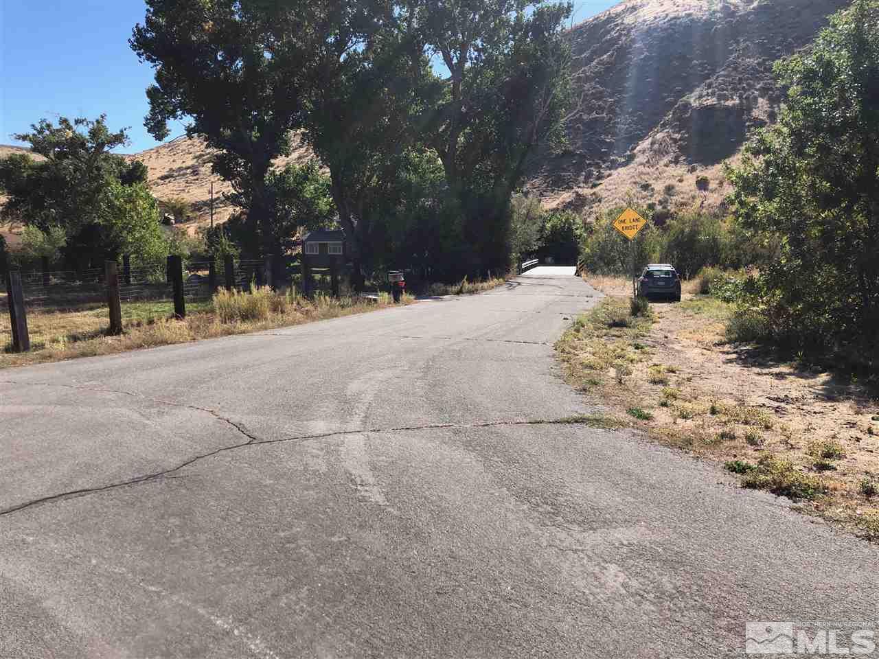 22864 Conestoga Circle Reno, NV 89521 - Photo 6 of 9 a view of a yard with a tree