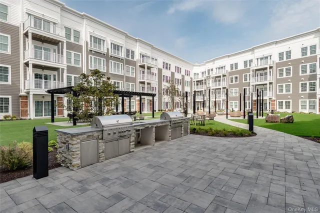 a front view of building with a garden