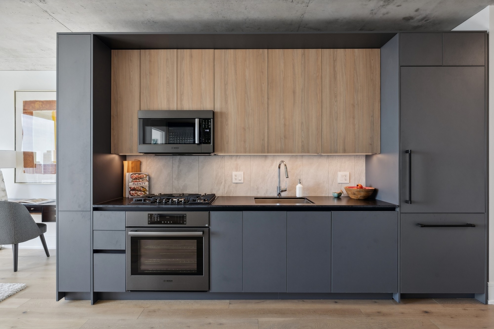 234 West Polk Street, Unit 2607 Chicago, IL 60607 - Photo 5 of 30 a kitchen with stainless steel appliances a stove a microwave a sink and cabinets