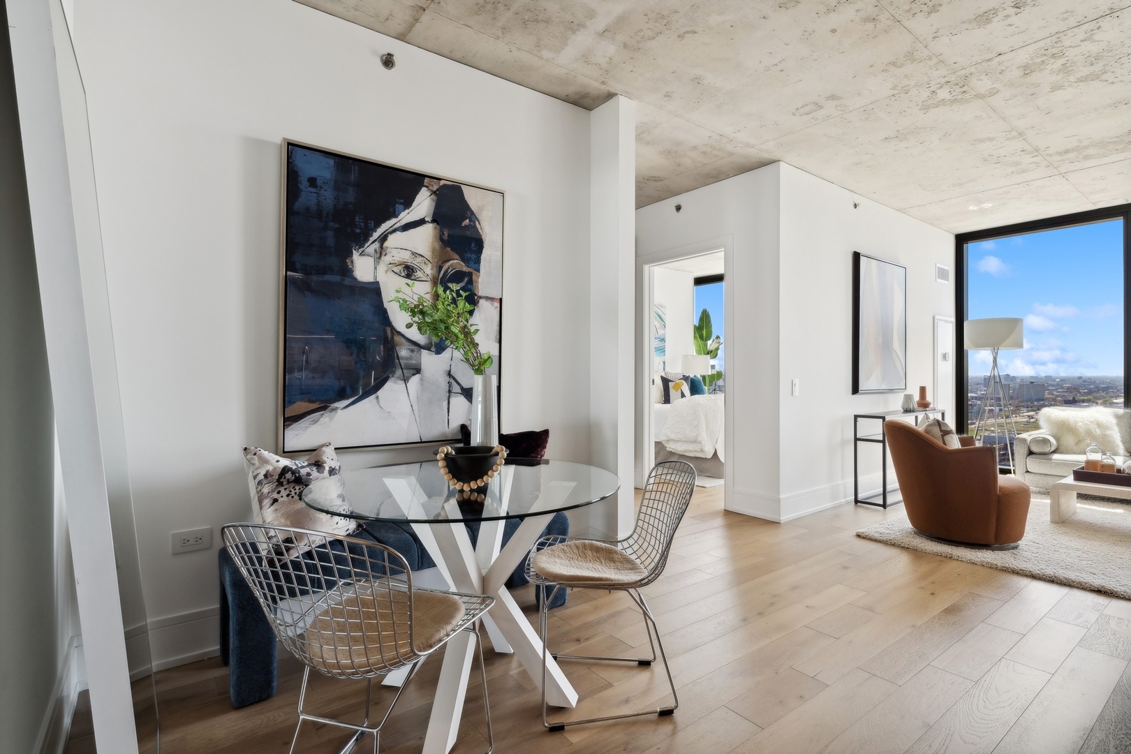 234 West Polk Street, Unit 2607 Chicago, IL 60607 - Photo 8 of 30 a view of a dining room with furniture and chandelier