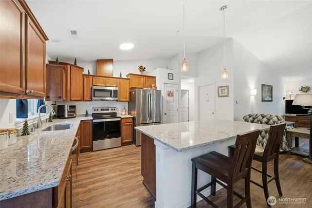 a large kitchen with a table and chairs