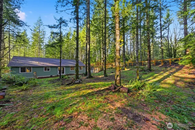 a view of backyard with a table and chairs
