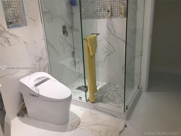 a bathroom with a sink and toilet