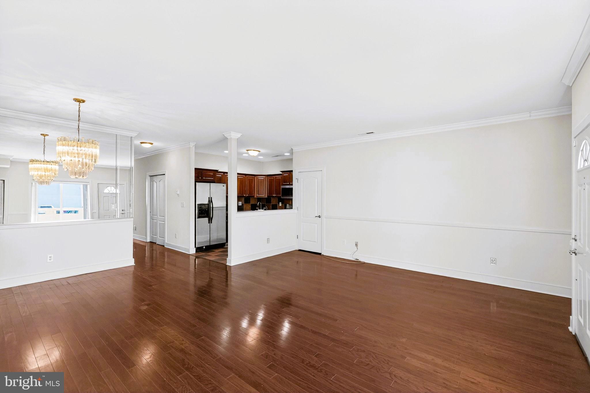 1630 Welsh Road, Unit 5A Philadelphia, PA 19115 - Photo 11 of 27 a view of empty room with wooden floor and window