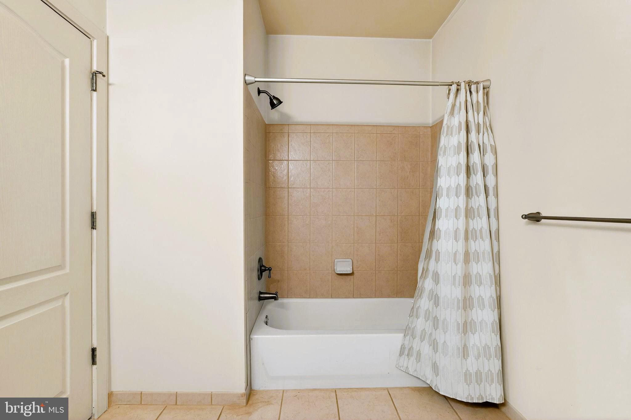 1630 Welsh Road, Unit 5A Philadelphia, PA 19115 - Photo 15 of 27 a bathroom with a bathtub and shower