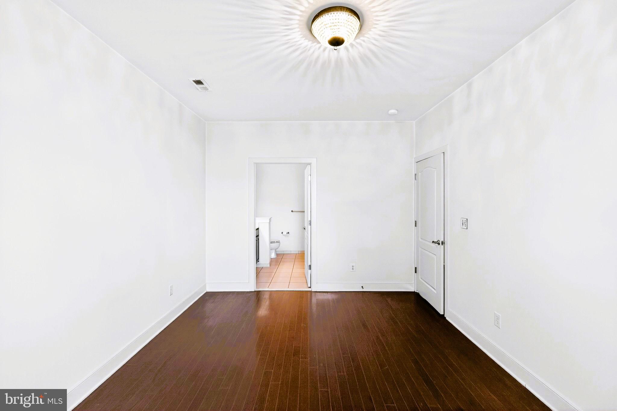 1630 Welsh Road, Unit 5A Philadelphia, PA 19115 - Photo 18 of 27 a view of a room with wooden floor and natural light