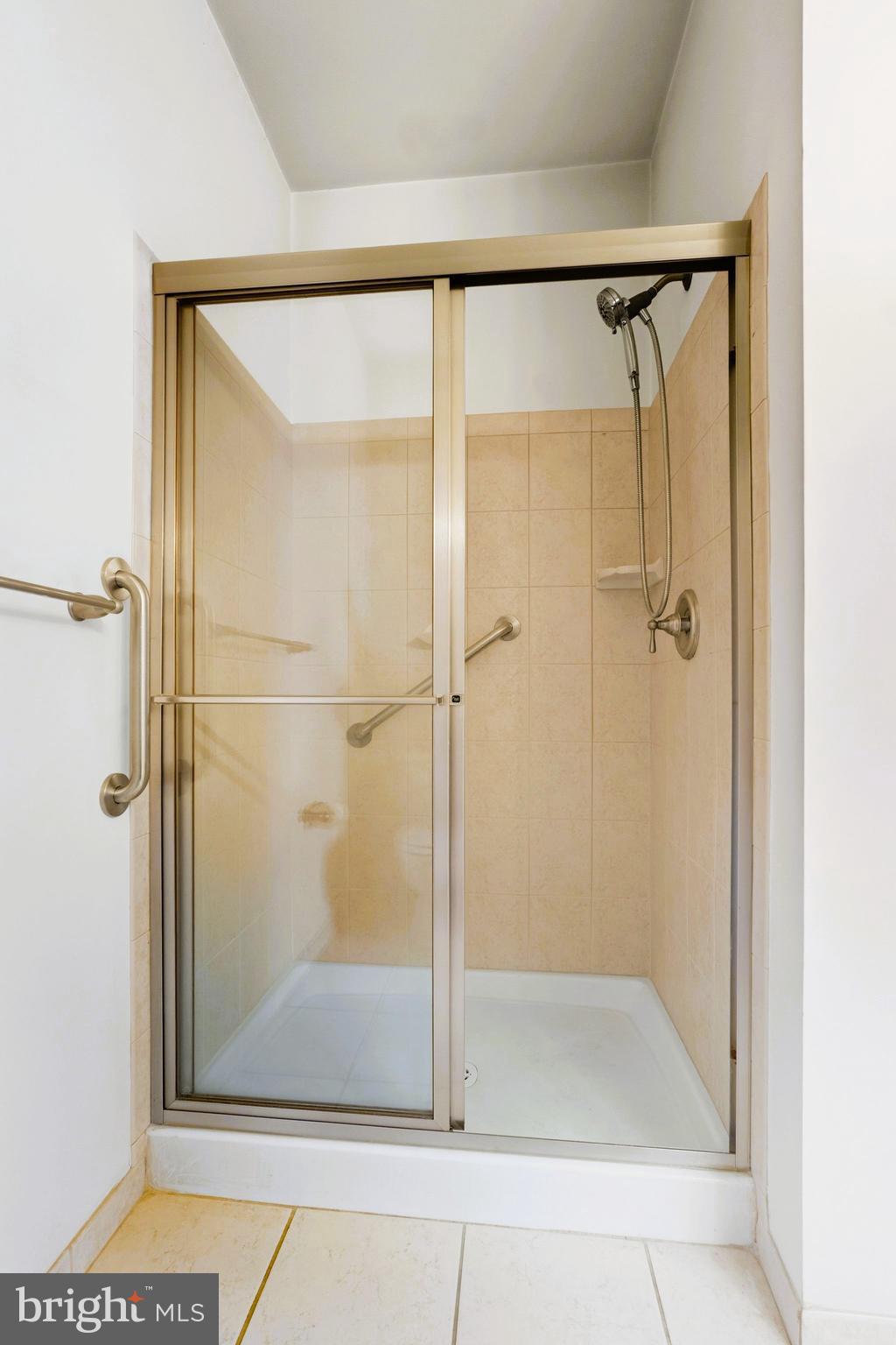 1630 Welsh Road, Unit 5A Philadelphia, PA 19115 - Photo 21 of 27 a bathroom with a glass shower door