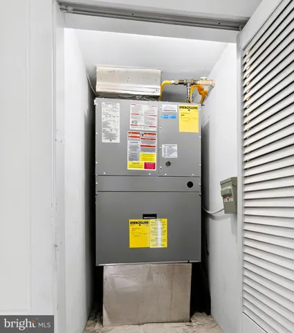 a view of a white house with a street