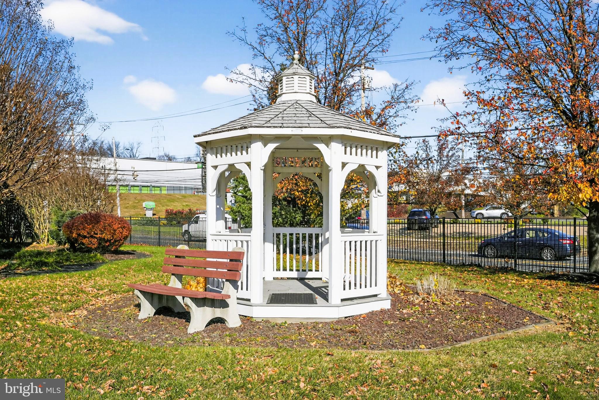 1630 Welsh Road, Unit 5A Philadelphia, PA 19115 - Photo 26 of 27 a view of a house with a yard patio and fire pit