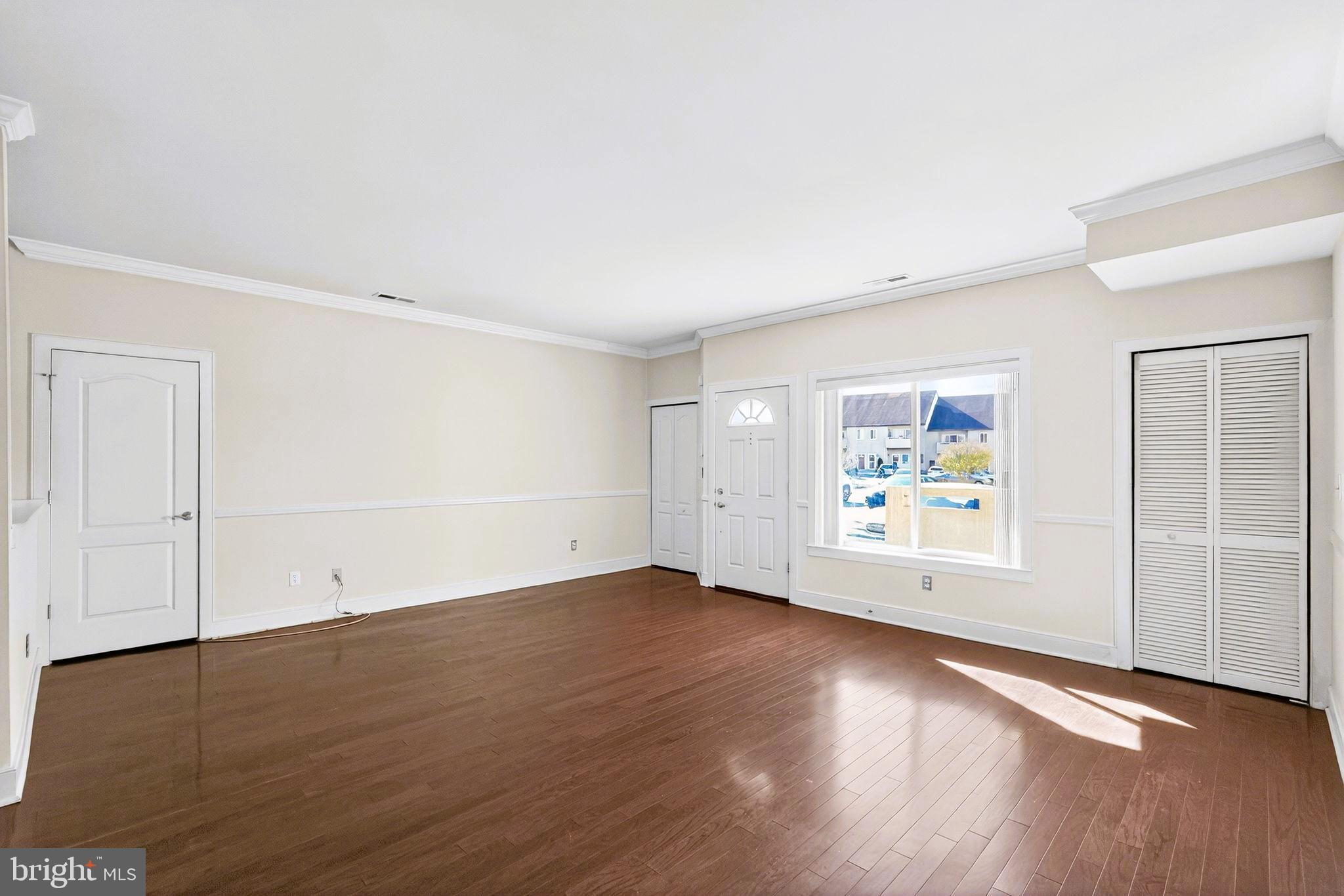 1630 Welsh Road, Unit 5A Philadelphia, PA 19115 - Photo 8 of 27 an empty room with wooden floor and window