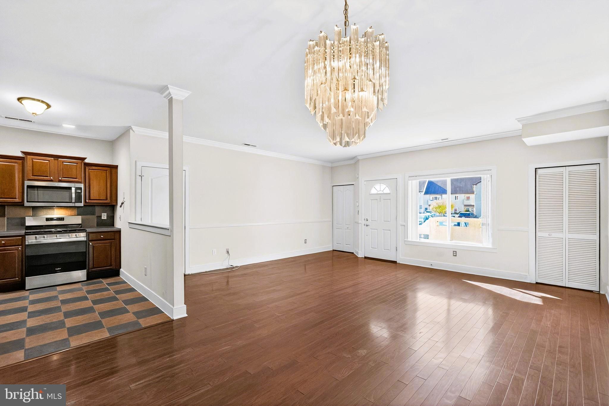 1630 Welsh Road, Unit 5A Philadelphia, PA 19115 - Photo 9 of 27 a view of a kitchen with wooden floor and stainless steel appliances