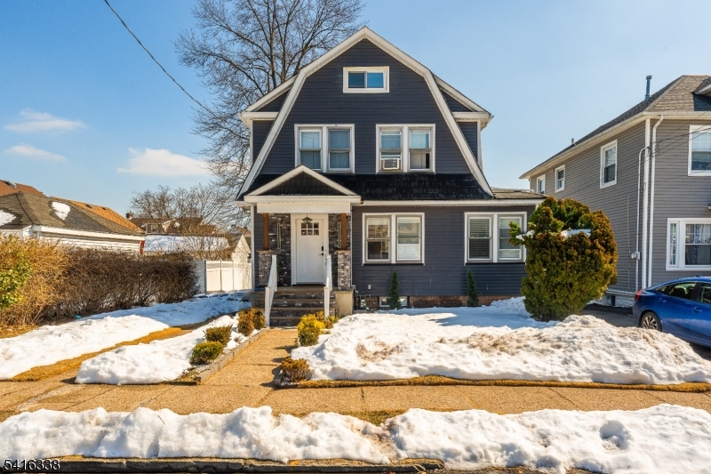 a front view of a house with a yard outdoor space