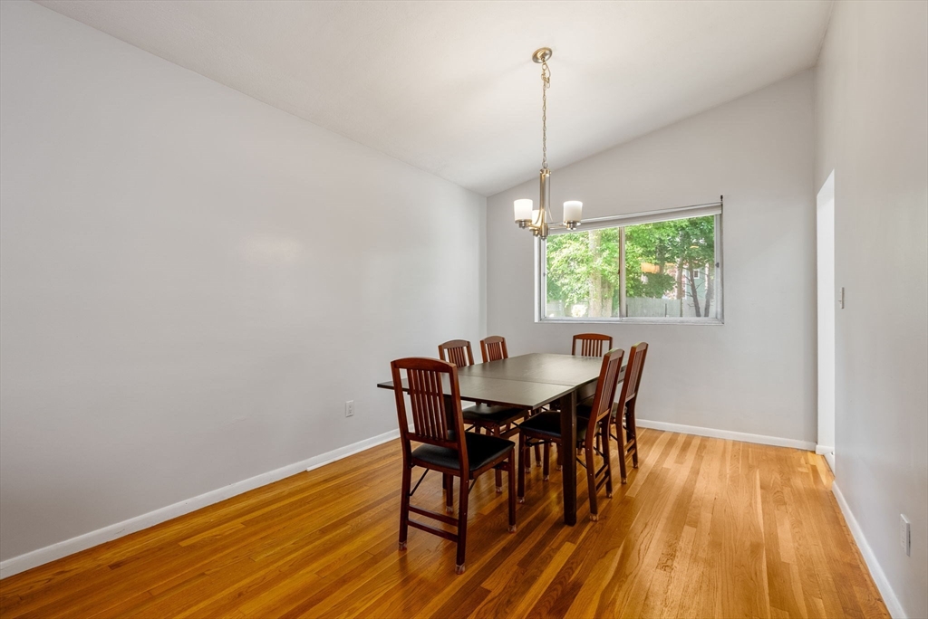372 Old Connecticut Path Framingham, MA 01701 - Photo 11 of 33 a view of a dining room with furniture window and wooden floor