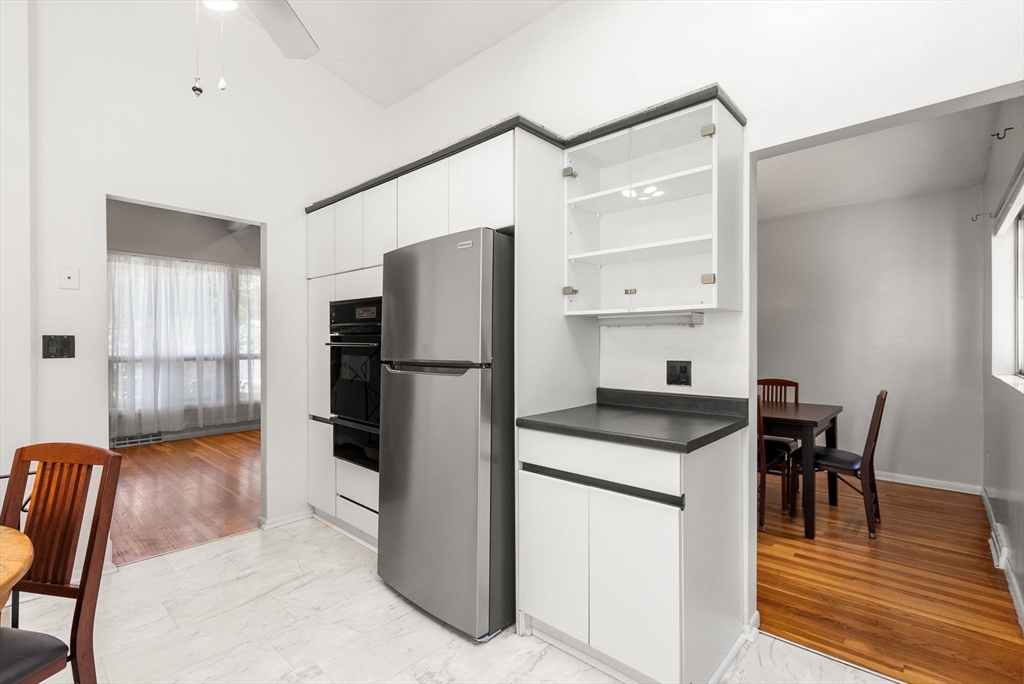 372 Old Connecticut Path Framingham, MA 01701 - Photo 14 of 33 a kitchen with refrigerator cabinets and wooden floor