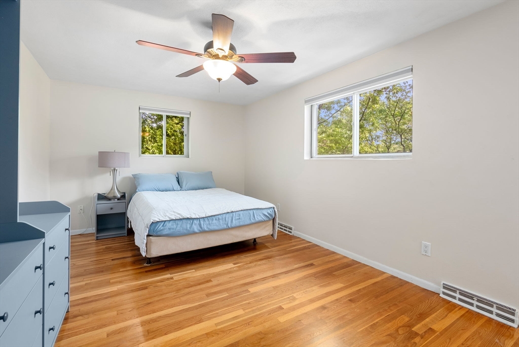 372 Old Connecticut Path Framingham, MA 01701 - Photo 18 of 33 a bedroom with a bed and a painting on the wall