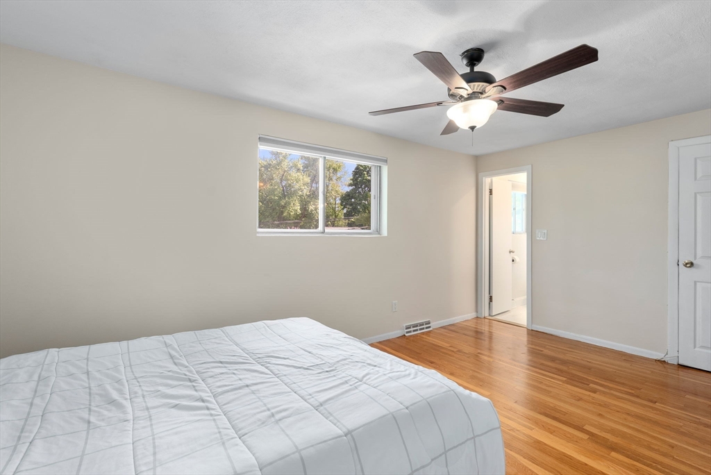 372 Old Connecticut Path Framingham, MA 01701 - Photo 21 of 33 a bedroom with a large bed and a window