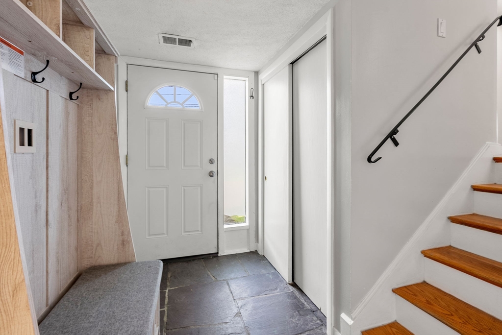 372 Old Connecticut Path Framingham, MA 01701 - Photo 3 of 33 a view of a hallway with wooden floor and entryway