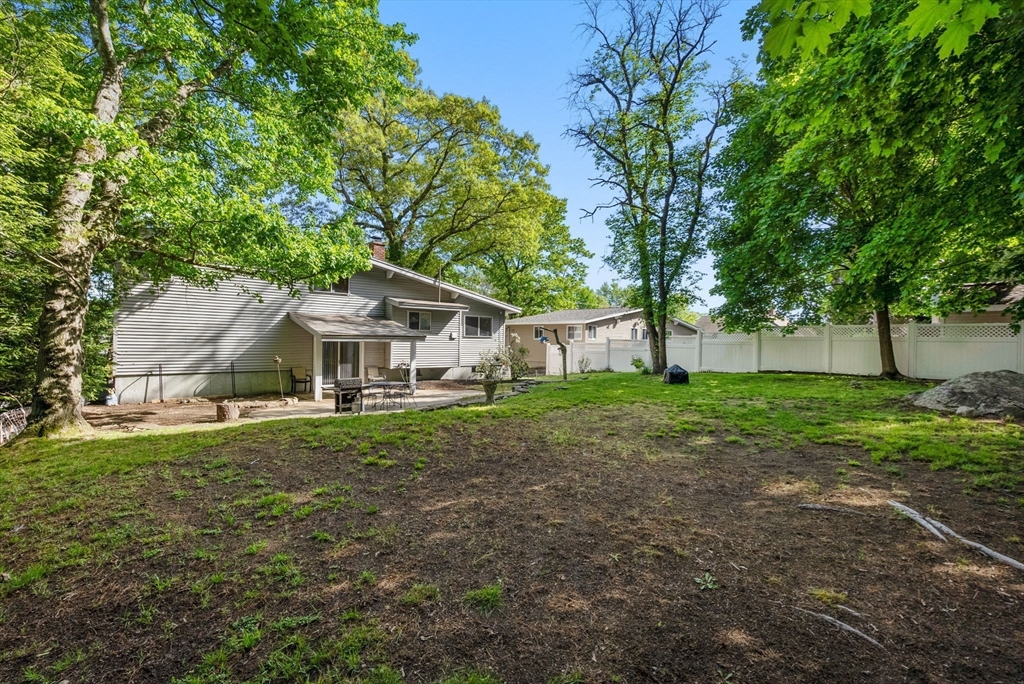 372 Old Connecticut Path Framingham, MA 01701 - Photo 32 of 33 a white house in middle of the green field