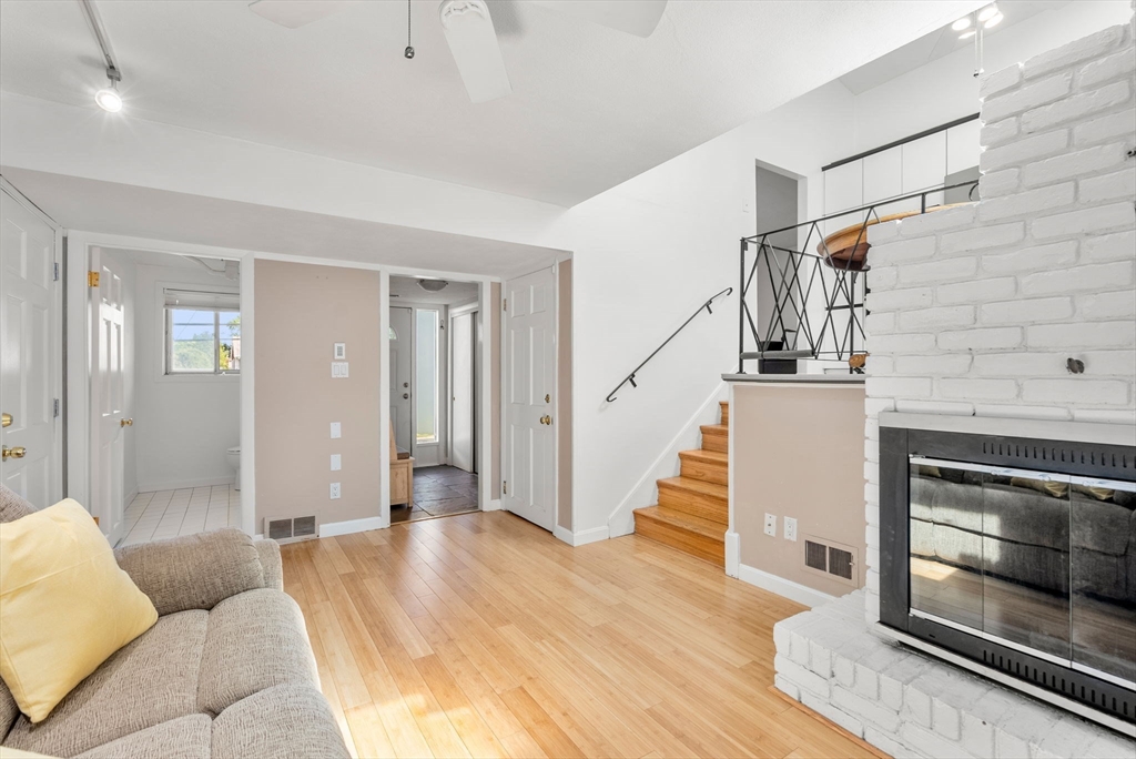 372 Old Connecticut Path Framingham, MA 01701 - Photo 6 of 33 a view of a livingroom with wooden floor and staircase