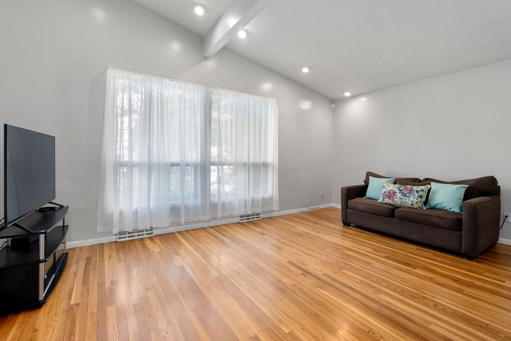 372 Old Connecticut Path Framingham, MA 01701 - Photo 8 of 33 a living room with furniture and a wooden floor