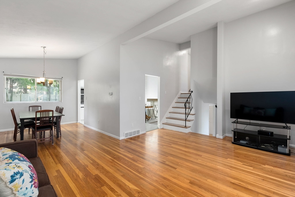 372 Old Connecticut Path Framingham, MA 01701 - Photo 10 of 33 a view of a livingroom with furniture and wooden floor