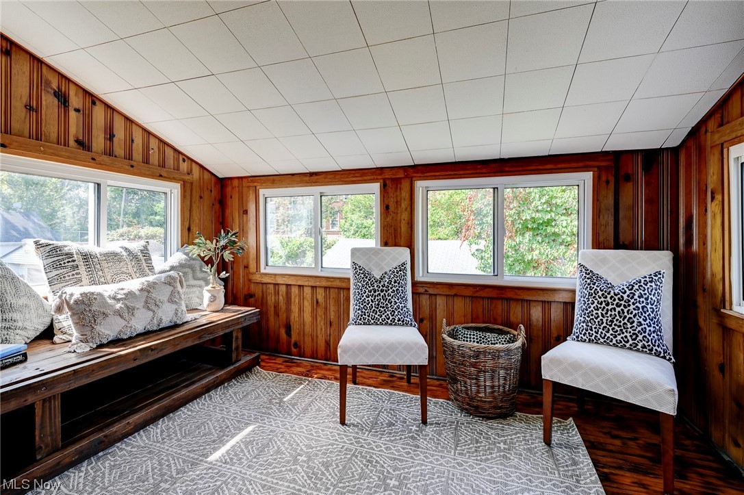 4464 Broadale Road Cleveland, OH 44109 - Photo 21 of 26 Sitting room with wood walls, vaulted ceiling, and light floors