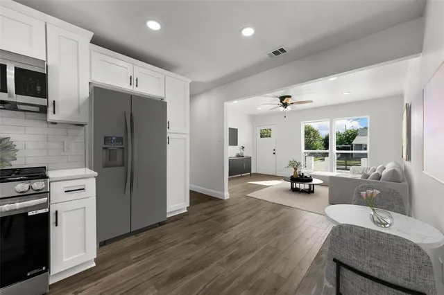 a kitchen with sink refrigerator and stove