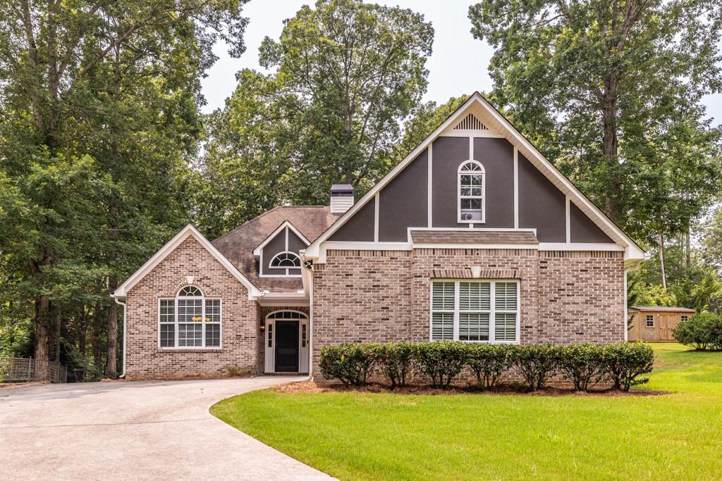 3315 Lakeview Parkway Villa Rica, GA 30180 - Photo 1 of 1 a front view of a house with a yard