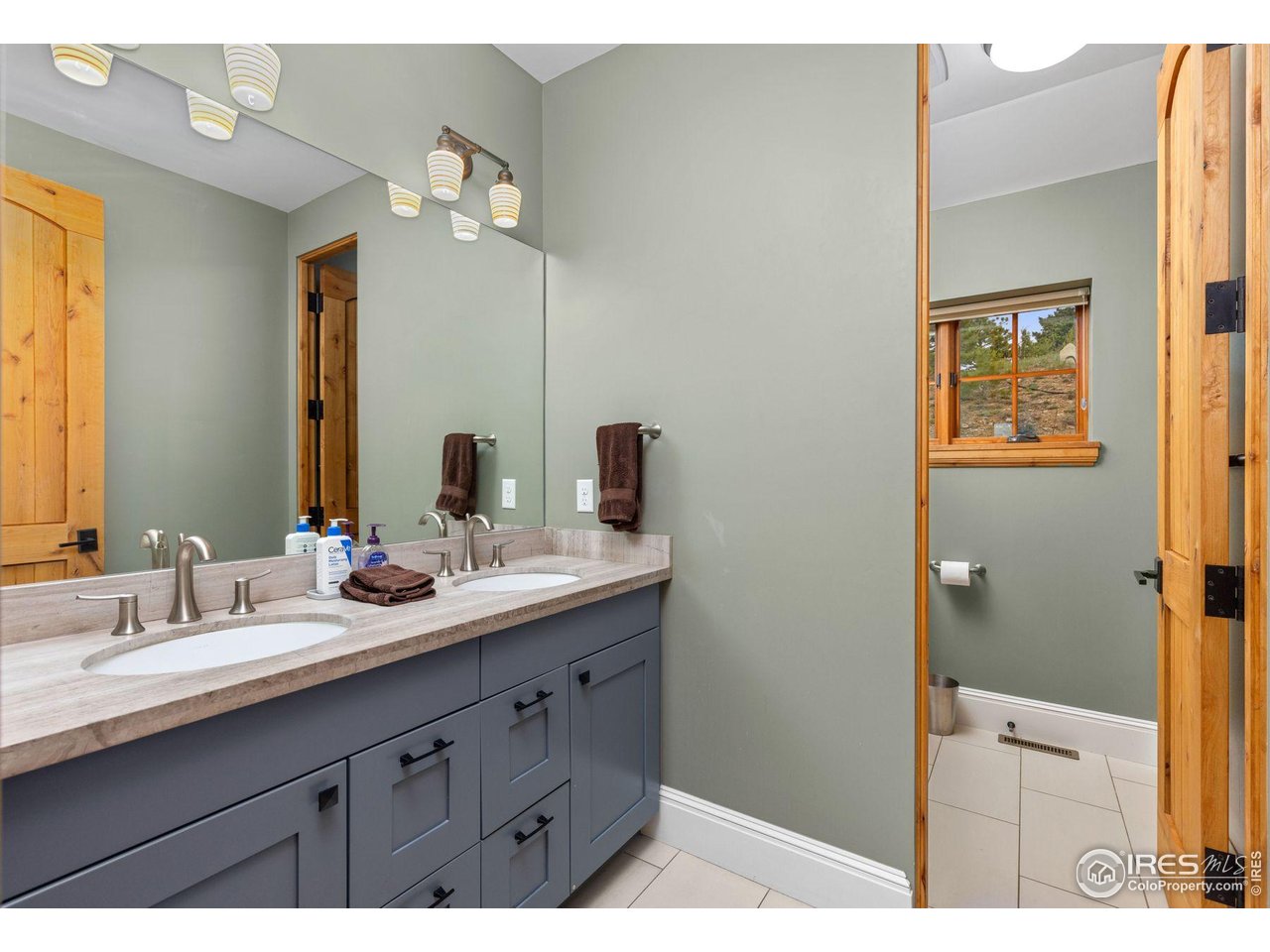 750 Left Fork Road Boulder, CO 80302 - Photo 21 of 39 a bathroom with a sink and a mirror