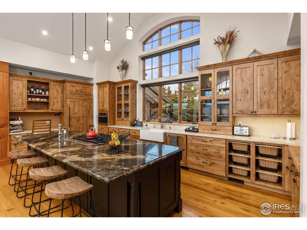 750 Left Fork Road Boulder, CO 80302 - Photo 4 of 39 a kitchen with kitchen island granite countertop a sink and cabinets