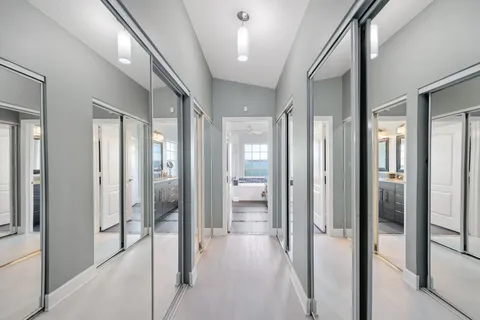 a front view of a house with swimming pool and porch