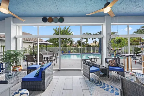 an aerial view of residential houses with outdoor space and trees all around