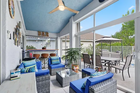 a view of a patio with a table and chairs