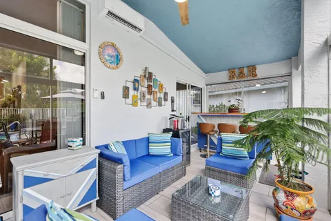 a view of a field of grass and trees