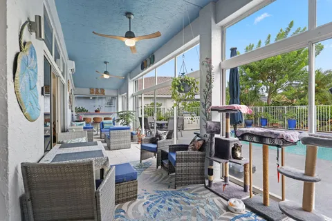 an aerial view of a house with swimming pool garden and patio