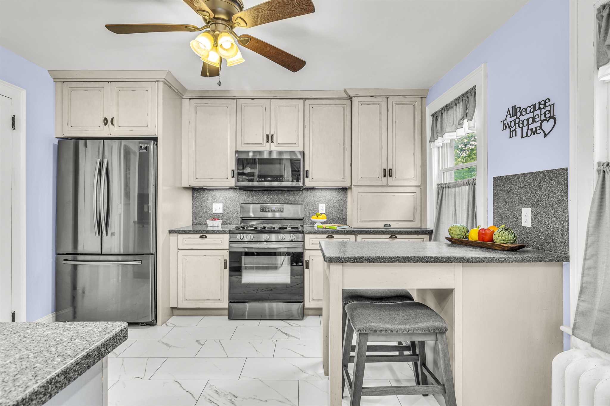 22 Pine Street Pine Plains, NY 12567 - Photo 12 of 25 a kitchen with stainless steel appliances a stove a refrigerator and a sink