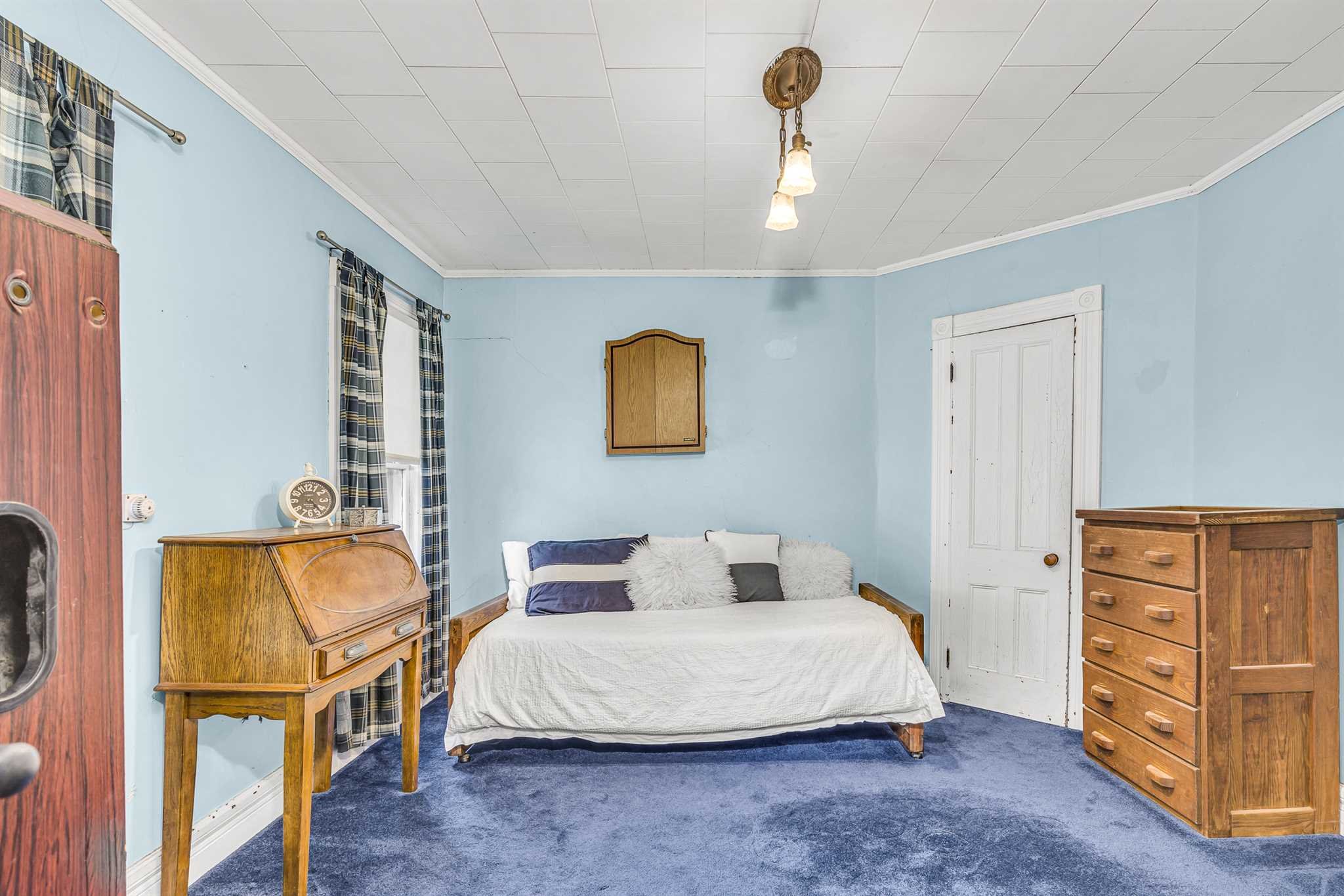 22 Pine Street Pine Plains, NY 12567 - Photo 18 of 25 a bedroom with a bed and dresser with mirror